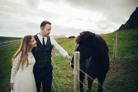Amazing romantic view of happy couple near beautiful grand waterの写真素材