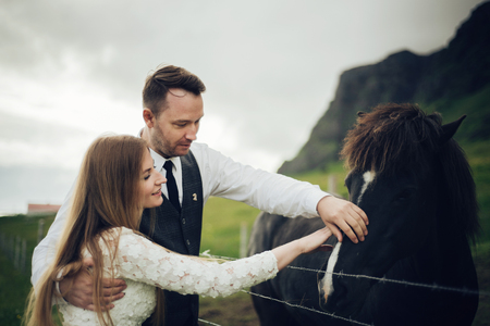 Amazing romantic view of happy couple near beautiful grand waterの写真素材