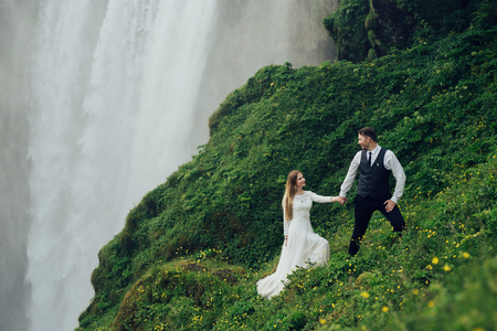 Amazing romantic view of happy couple near beautiful grand waterの写真素材