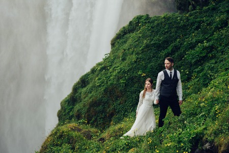 Amazing romantic view of happy couple near beautiful grand waterの写真素材