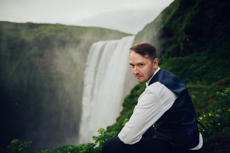 Happy stylish smiling couple walking and kissing in Iceland , onの写真素材