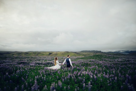 Amazing romantic view of happy couple near beautiful grand waterの写真素材