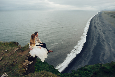 Amazing romantic view of happy couple near beautiful grand waterの写真素材