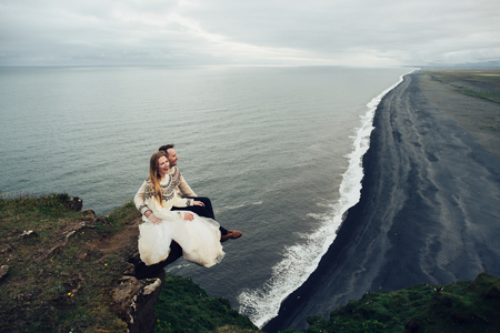 Amazing romantic view of happy couple near beautiful grand waterの写真素材