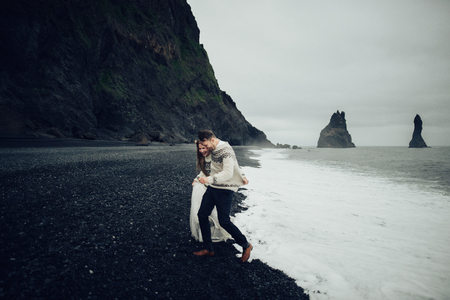 Amazing romantic view of happy couple near beautiful grand waterの写真素材