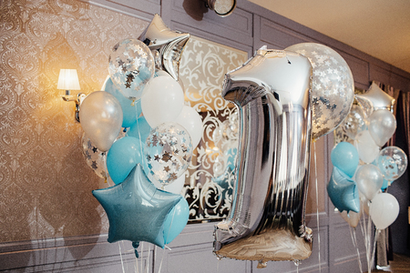Anniversary or birthday photo zone with white, blue and transparの写真素材