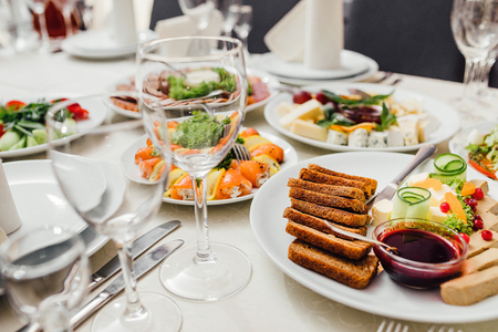 Beautifully decorated catering banquet table with different foodの写真素材