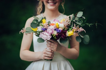 luxury stylish young bride and groom on the background spring su