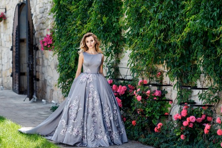 beautiful happy brunette woman in the park on a warm summer dayの写真素材