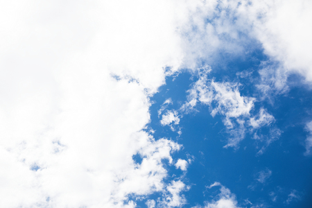 Blue sky background with tiny clouds.の写真素材