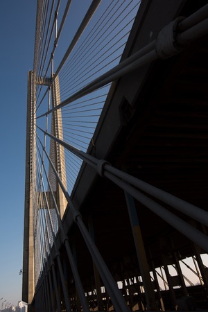 Modern bridge steel ropes constructions on sky  backgroundの写真素材