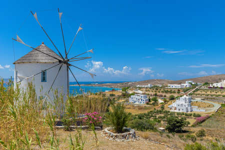 Traditional Cycladitic view with  whitewashed houses and a scenic windmill in  Paros island, Greece.の写真素材