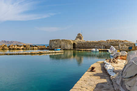 Traditional Cycladitic view with moored traditional fishing boats   at the picturesque harbor of...