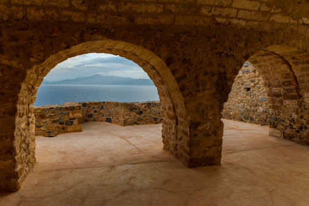 Yellow stone's arch and view of the sea from upper town  the medieval  castle of Monemvasia,...