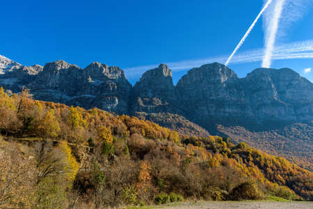 view of towers of Astraka above Papigo stone village ,during fall season in epirus  Greeceの写真素材