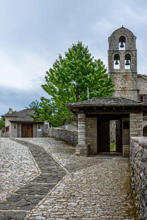 Traditional architecture with  narrow  street and stone buildings a in Monodendri village  central Zagori Greeceの写真素材