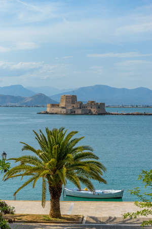 Spring view of historical  Venetian water castle of Bourtzi located in  the old harbour of Nafplio...