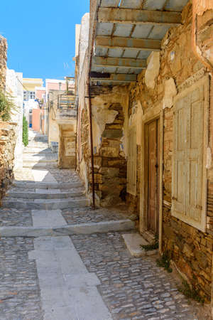Traditional cycladitic   alley with narrow street and  traditional houses, in ano Syros Greece.の写真素材