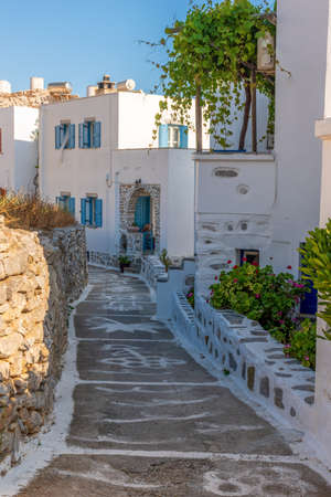 Traditional cycladitic   alley with a narrow street,  whitewashed  houses and  blooming flowers in Chora Amorgos  Greeceの写真素材