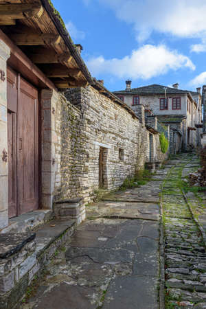 The picturesque village of Dilofo during fall season with its architectural traditional old stone  buildings located on Tymfi mount, Zagori, Epirus, Greece, Europeの写真素材