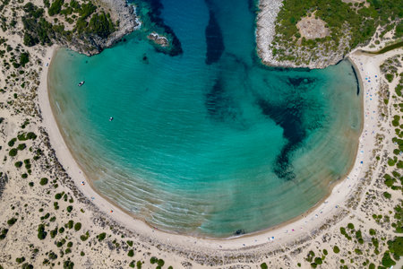 Aerial drone photo of the iconic  semicircular sandy beach of Voidokoilia in Messinia, Gialova, Peloponnese, Greeceの写真素材