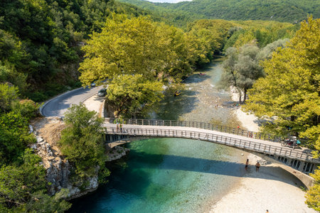 Aerial view of  voidomatis river with the clear waters and the famous bridge in epirus Greece.
