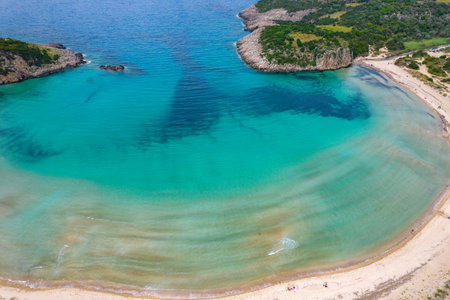 Aerial drone photo of the iconic  semicircular sandy beach of Voidokoilia in Messinia, Gialova, Peloponnese, Greeceの写真素材