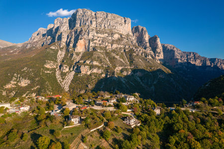 Aerial view of the traditional stone village vikos with astraka mountain as  background in zagori epirus, Greeceの写真素材