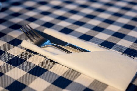 Fork and knife in a napkin