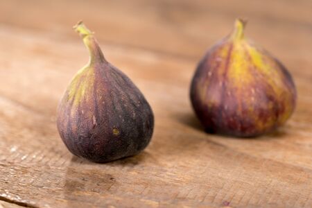 Fresh figs on the wooden tableの写真素材