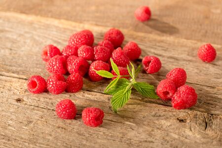 Raspberries on wooden table