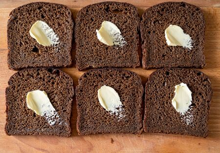 Slice of bread with butterの写真素材