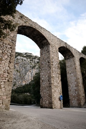 Big arches with road blue signの写真素材