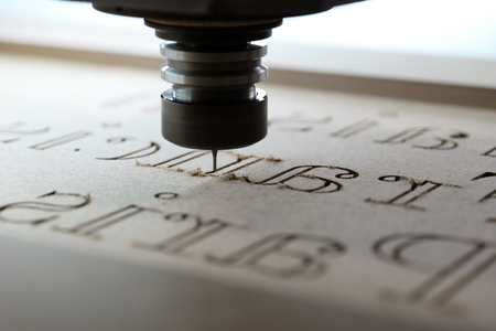 Laser machine cutting lettersの写真素材