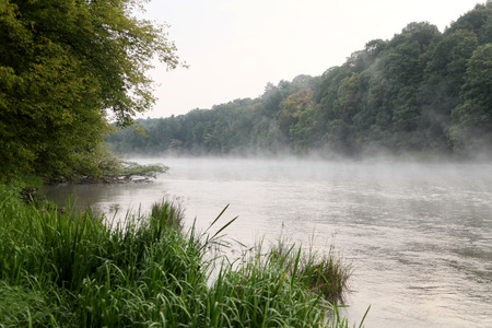 Sunrise over the foggy river