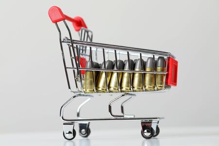 Gun bullets in shopping cartの写真素材