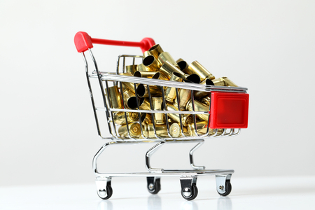 Gun bullets in shopping cartの写真素材