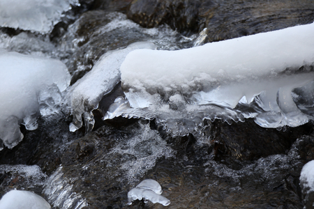 Frozen rocks in the riverの写真素材
