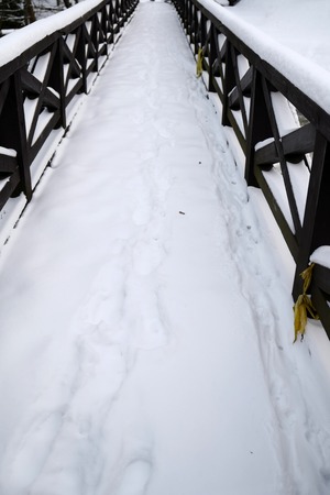 Bridge covered by snowの写真素材