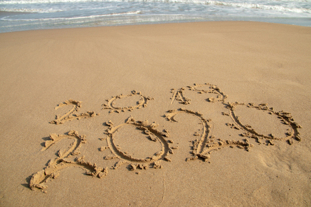 2020 Year written on the beach sand