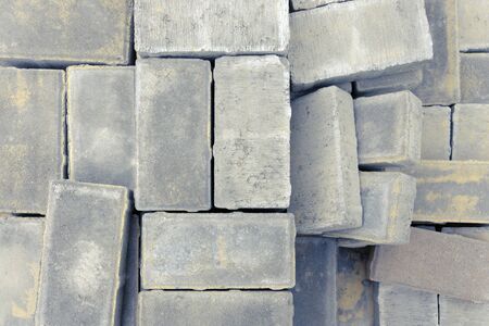 paving bricks lie on a pallet ready for construction work on laying paving slabs on the road or sidewalkの写真素材