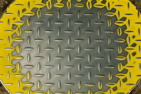 metal grooved plate with yellow trimの写真素材