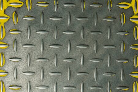 metal grooved plate with yellow trimの写真素材