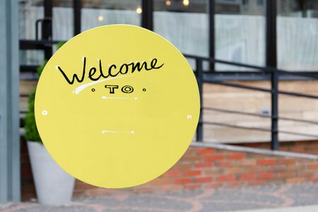 retro outdoor yellow sign Welcome to with copy spaceの写真素材