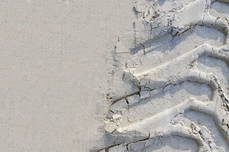 Traces of car tires in the sand. tire tracks on the beach. offroad trophy. background with copy spaceの写真素材