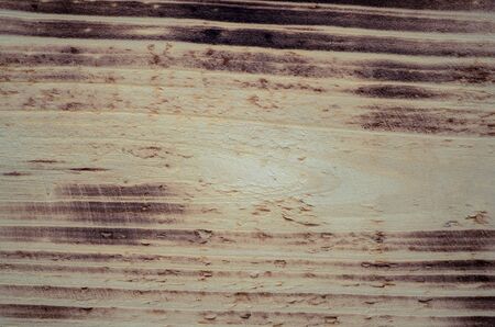 dark wood burnt texture may be used as background closeの写真素材