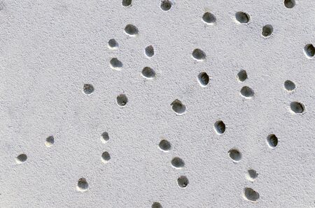 small holes on the surface of the sand. summer background. recreationの写真素材