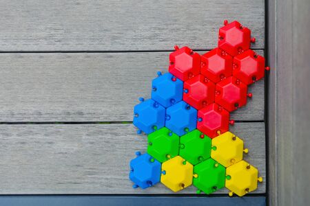 The concept of a united group is a multitude of different hexagons, connected and inextricably linked with each other, as an inextricable chain, as a metaphor for trust and community faithの写真素材
