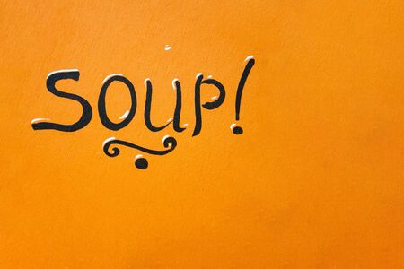 Meal time, lunch time. Eating time concept. Can be used for layout, banners and web design. The word soup on an orange backgroundの写真素材