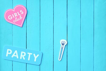 background for advertising visage and makeup. the inscription Girls club in the form of a heart and the inscription Party on a light blue fence. Women's Day Party celebrationの写真素材